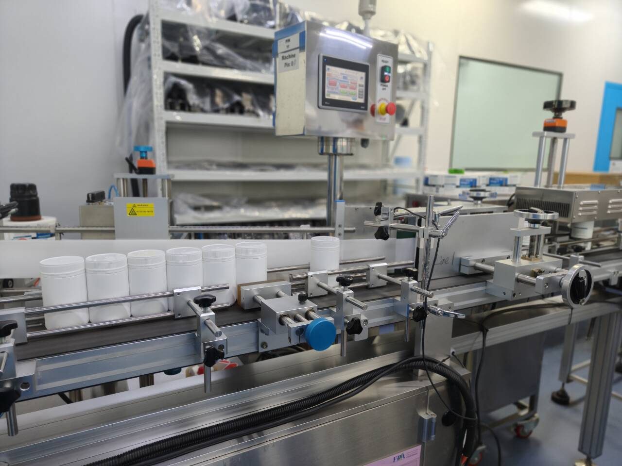Automated bottle filling and capping line